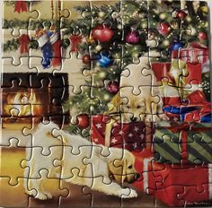 a jigsaw puzzle with two dogs in front of a christmas tree