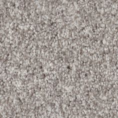 a close up view of a carpet textured with light gray and white color scheme