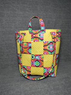 "Large quilted tote. Great for the beach, outings, shopping, gym, travel, etc.  Deep enough for larger items. Two lengths of handles for convenience. Quilted and fully lined with interior pocket. Dimensions: 16 1/2\" wide. 13\" tall. 6 1/2\" deep." Quilted Bags For Everyday Summer Use, Quilted Summer Bags, Summer Quilted Bag, Yellow Square Beach Bag, Beach Tote, Open Top, The Beach, Handles, Yellow