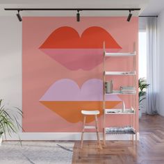 a pink and orange wall mural with lips on it