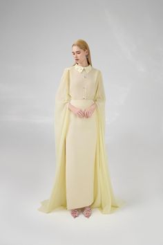 This chiffon set features a sheath silhouette and hanging sleeves, making it perfect for any formal occasion. The flowy, floor-length design is both elegant and comfortable, ensuring you look and feel your best all night long. The perfect combination of style and functionality. Length: 60cm (Front length of top), 107cm (Skirt) Georgette Maxi Dress With Cape Sleeves, Chiffon Gown With Cape Sleeves, Fitted Chiffon Evening Dress With Cape Sleeves, Chiffon Wedding Gown With Cape Sleeves, Elegant Spring Maxi Dress With Cape, Elegant Evening Dress With Sheer Cape Sleeves, Chiffon Long Sleeve Gown For Gala, Chiffon Long Sleeve Gala Gown, Chiffon Maxi Dress With Cape Sleeves For Evening