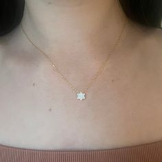 This dainty white opal Jewish star necklace has a beautiful, modern look. Available with gold or silver chain. Size: 16" Chain. 1/4" star Shop Star of David Jewelry Shop our full collection of Jewelry Minimalist Star Of David Necklace For Everyday, White Star-shaped Clavicle Chain Necklace, Dainty Star Of David Charm Necklace With Delicate Chain, Dainty White Star Necklaces, Dainty White Star Necklace, Jewish Star Necklace, Jewish Star, Star Necklace Gold, Bat Mitzvah Gifts