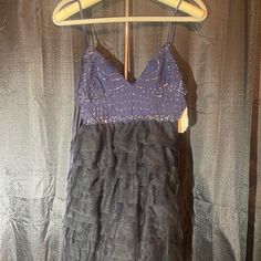 This Free People Sleeveless Dress Is Perfect For Any Occasion. The Black And Purple Color Combination Is Striking And Unique, Making It A Great Addition To Any Wardrobe. The Dress Is Available In Size Extra Small And Is Designed To Flatter Your Figure With Its Maxi Style And Short Dress Length. The Dress Is New With Tags, Ensuring That You Are Receiving A Quality Item. It Is Made From High-Quality Materials And Is Perfect For Any Fashion-Forward Woman Who Wants To Make A Statement. Don't Miss Ou Purple Sleeveless Embellished Sequin Dress, Purple Color Combinations, Bohemian V-neck Embellished Mini Dress, Purple Embellished Mini-length Dress, Black V-neck Lace Patchwork Dress, Black And Purple, Maxi Styles, Free People Dress, Mini Fashion