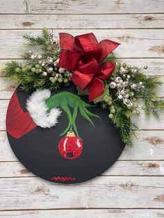 a christmas wreath with a grin on it