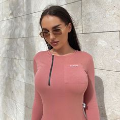 Sportswear Long Sleeve with Pocket Skinny Jumpsuit Athleisure Long Sleeve Bodysuit, Sporty Bodysuit For Spring Loungewear, Sporty Spring Bodysuit For Loungewear, Long Sleeve Workout Bodysuit, Casual Long Sleeve Workout Bodysuit, Sporty Bodysuit For Spring Workout, Sporty Workout Bodysuit, Casual Pink Bodysuit For Workout, Spring Athleisure Sports Bodysuit