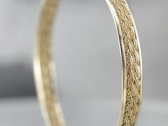 This is such a pretty and classic piece! The texture of the woven center gives the bangle a rich, luxurious profile. It will work great as a stacking bracelet, and is still beautiful all on its own. The condition is fantastic, and the design is light and airy but still substantial with strong, structural lines. Metal: 14K Yellow Gold Width: 6.4 mm Inside Circumference: 7 inches Marks: "14K" Stamped on the clasp Filigree Bangle, Vintage Gold Bracelet, Pearl Bangle Bracelet, Gold Link Necklace, Marquise Shape Diamond, Gold Link Bracelet, Vintage Rose Gold, Pearl Bangle, Bracelets Gold Diamond