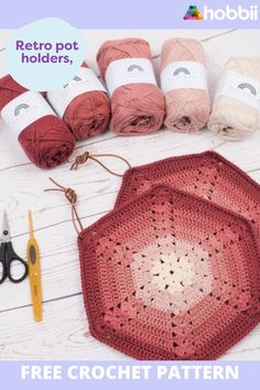 the crochet pattern is displayed with scissors, yarn and other crafting supplies