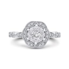 A gorgeous vintage style design engagement ring. Take a moment and look at the details. Do you notice the scalloped design? The milgrained edges? These are characteristics of engagement rings made back in the 1920s. The center is a diamond cluster. So you get a big 1ct look without the big price. Gorgeous ring at a beautiful price. Milgrain Diamond Wedding Jewelry, Wedding Diamond Jewelry With Milgrain, Wedding Diamond Milgrain Jewelry, Elegant Milgrain Diamond Ring For Wedding, Elegant Milgrain Diamond Wedding Ring, Fine Jewelry Wedding Rings With Milgrain Detail, Vintage Diamond Ring With Halo Design For Anniversary, Vintage Halo Design Diamond Ring With Round Cut, Vintage White Gold Ring With Halo Design