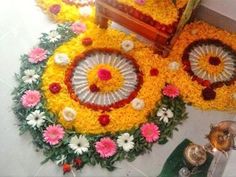 an arrangement of flowers and petals on the floor