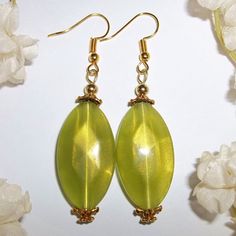 Statement Earrings Green And Gold Handmade Beaded Dangle Drop Jewelry Gift 5487 This Drop Dead Gorgeous Beaded Earring Set Is Brand New & Handmade By Me - Wvluckygirl. Handcrafted With Green Oval Acrylic Faceted Beads That Have A Mesmerizing Gold Shimmer In The Light. They Have Antiqued Gold Toned Costume Jewelry Beads. The Pair Dangle & Drop From French Fishhook Ear Wires For Women's Pierced Ears. Measure 2 1/5 Inches Tall & 5/8 Inches Wide. Each Single Earring Weighs 3.3 Grams. Unique Funky Gi Elegant Beaded Earrings With Oval Beads, Elegant Green Earrings With Faceted Beads, Handmade Oval Beaded Earrings, Elegant Yellow Beaded Dangle Earrings, Elegant Yellow Beaded Earrings For Gift, Funky Gifts, Elegant Sophisticated, Goddess Braids, Gold Shimmer