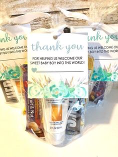 three bags filled with candy sitting on top of a white counter next to each other