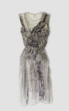 an image of a dress with fringes on the front and back, in grey