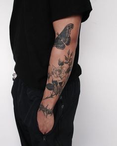 a man with a tattoo on his arm