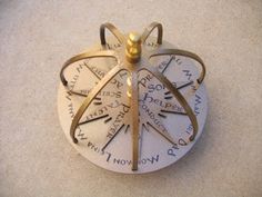 a close up of a clock with roman numerals on it