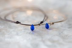 Dainty minimalist teardrop choker necklace. Featuring a cobalt blue glass teardrop on cord. Fully adjustable with a sliding knot closure. CHOOSE YOUR COLOR CORD: ⌁ Tan Cord ⌁ Dark Brown Cord ✺ SIZE GUIDE ✺ ⌁ This choker is designed with a sliding knot closure and will comfortably adjust to a minimum of 13 inches to a maximum of 24 inches. ⌁ How to measure your neck size: If you don't have a seamstress tape measure, take a piece of yarn or string and wrap it around your neck to a comfortable fit Blue Adjustable Necklace For Friendship, Adjustable Blue Necklace For Friendship, Blue Minimalist Jewelry With Sliding Knot, Minimalist Blue Jewelry With Sliding Knot, Minimalist Blue Jewelry With Adjustable Length, Blue Adjustable Waxed Cord Jewelry, Minimalist Blue Jewelry With Adjustable Cord, Simple Charm Necklace, Cord Choker