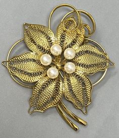 VINTAGE MCM Filigree Flower Brooch Faux Pearl Cluster Center Open Wire MCM 2.5" Elegant Flower Brooches For Vintage Events, Vintage Flower Brooches For Formal Occasions, Retro Floral Brooch For Formal Occasions, Ornate Flower Brooches For Formal Occasions, Vintage Flower Shaped Brooches For Formal Occasions, Vintage Flower Brooches For Vintage Events, Vintage Flower Brooch For Evening, Vintage Yellow Gold Flower Shaped Jewelry, Retro Formal Flower Brooch