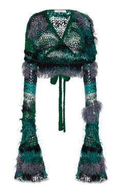 a green and grey knitted hat with tassels