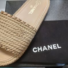 Chanel Size 41 Slides Luxury Brown Sandals With Woven Sole, Brown Designer Sandals With Woven Sole, Luxury Beige Sandals With Woven Sole, Designer Beige Sandals With Woven Sole, Luxury Slip-on Sandals With Woven Sole, Luxury Sandals With Woven Sole And Round Toe, Beige Designer Sandals With Cushioned Footbed, Designer Beige Slip-on Sandals, Designer Beige Calf Leather Sandals