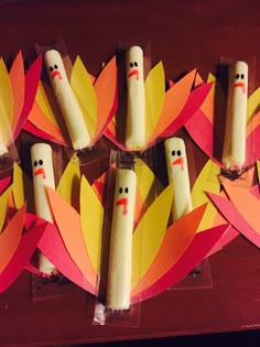 some candles are made to look like turkeys and have faces painted on the sticks