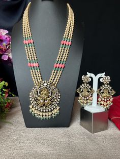 Lakshmi Narasimha Swamy Haram Set  36 InchesLong/Kundan AD /Premium Quality/Antique Brass Gold Finish/Tulip Coral Pearls/Indian Jewelry  This item is perfect for parties and festivals Gift ! DETAILS: Includes One Haram 24 inches and  Earrings. Necklace: 36 inches long total Adjustable length. Chain closure. Weighs 4.65 oz ( 1.32 g).  Earrings: 3.5 inch(es) long.  width : 2. wide Earring set  weighs 1.60 oz (46 g). Earring back push on/off. Material: Imitation Gold Dimond Finish, Kemp Ruby Green Fusion Kundan Meenakari Necklace For Diwali, Traditional Kundan Temple Necklace For Designer Wear, Multicolor Cutdana Mala For Temple Jewelry, Multicolor Meenakari Mala For Diwali, Festive Fusion Kundan Necklace For Celebration, Festive Fusion Style Kundan Necklace For Celebrations, Fusion Kundan Necklace With Tilla For Puja, Multicolor Kundan Necklace With Zari Work For Puja, Fusion Style Kundan Chandbali Necklace For Puja