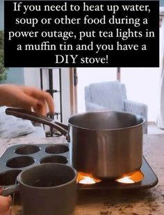 someone is pouring water into a pot on top of a stove with muffins in it