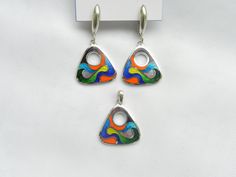 Georgian cloisonne enamel earrings and pendant  - Fine silver jewelry This jewelry is 100 % handmade by me in my studio. The technique is called Cloisonne enamel which is well known in Georgia. Many people in my country love buying handmade jewelry because they are unique and special!  ▪️ ▪️ ▪️ About shipping▪️ ▪️ ��▪️ The price for this item includes standard shipping cost. Estimated arrival time: 3-4 weeks. ▪️ Delays might occur due to the current situation worldwide. So, please be careful when Cloisonne Enamel Jewelry, Hand Carved Jewelry, Earrings Triangle, Cloisonne Earrings, Vitreous Enamel, Artisan Necklace, Fine Silver Jewelry, Cloisonne Enamel, Enamel Bracelet