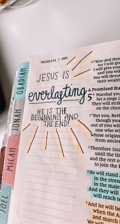 an open bible with the words jesus is enveloping and he is the beginning