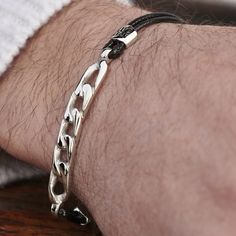 * Danish design 
 * Stainless steel – nickel free 
 * Lobster claw closure 
 * Gift pouch provided Cotton Bracelet, S Bracelet, Metal Detail, Chain Links, Gift Pouch, Black Gift, Waxed Cotton, Danish Design, Chain Link