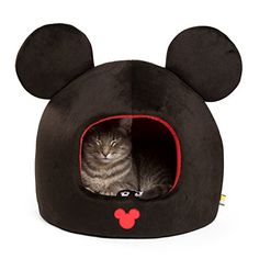 a cat laying in a mickey mouse bed