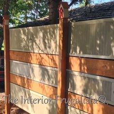 a wooden fence with two posts attached to it