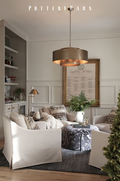 a living room filled with furniture and a christmas tree