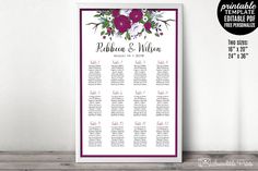 a purple and white floral wedding seating chart on a wooden shelf next to a wall