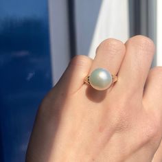 Two-tone 14KT white gold + yellow gold band ring with genuine, cultured Paspaley South Sea Pearl. Choose your finger size Contact us for additional sizes 12mm Paspaley Pearl; "Fine" quality; "Circle" shape Paspaley Certificate of Authenticity included Weight: 6.31g Made to order: please allow 7-10 business days prior to shipping Pearl will vary slightly from photos Gia Certified White Round Band Jewelry, Solitaire Dome Ring For Anniversary, White Dome Ring Fine Jewelry, Classic Round Dome Ring With Prong Setting, Fine Jewelry Dome Ring With Solitaire, Elegant Round Hypoallergenic Pearl Ring, Elegant Hypoallergenic Round Pearl Ring, Elegant Hypoallergenic Pearl Ring, White Round Pearl Ring Stamped 14k