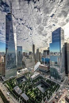 an aerial view of new york city with the one world trade center in the foreground