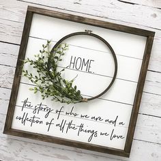 a framed sign that says, home the story of our one and a collection of all things we love