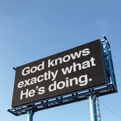 a large sign that says god knows exactly what he's doing