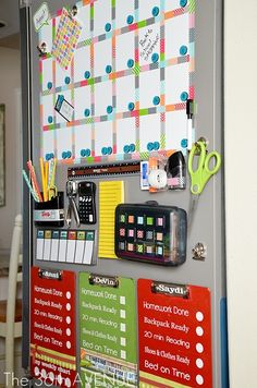 a bulletin board with many different items attached to it's sides and hanging on the wall