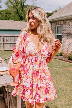 - Become a style muse with this gorgeous dress! Fully lined material - A v-cut neckline with a tie detail - Short, loose sleeves with elastic shoulders and elastic cuffs - A smocked bodice - A figure flattering silhouette that ends in a ruffled hemline Measurements S : Bust 32", Hip 36", Length 32", Sleeve Length 13.5", Waist 26-30". M : Bust 34", Hip 38", Length 33", Sleeve Length 14", Waist 28-32". L : Bust 36", Hip 40", Length 33.5", Sleeve Length 14", Waist 30-34". Summer Party V-neck Dress, V-neck Dress With Smocked Back For Brunch, Beach V-neck Dress With Elastic Sleeves, V-neck Mini Dress With Smocked Bodice For Beach, V-neck Maxi Dress With Gathered Sleeves For Brunch, Spring V-neck Dress With Smocked Back, Floral Print V-neck Dress For Summer Brunch, Casual V-neck Maxi Dress With Gathered Sleeves, Casual V-neck Dress With Gathered Sleeves