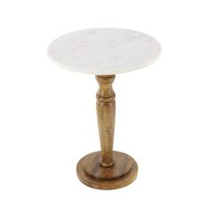 a white marble topped table on a wooden base with an aged wood leg and round top