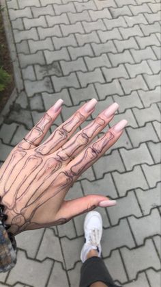 a person with their hands painted to look like they are holding something