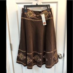 Coco & Tashi Boho Embroidered Midi Skirt. Gold Sequin And Beaded Designs. Size Small. New With Tags. Never Worn. Excellent Condition. This Soft Microcorduroy Skirt Is Fully Lined With A Side Zipper. The Pictures Don't Do It Justice. Beautiful Enbroidered Design With Sequins And Beads. Flows Beautifully. Would Look Perfect With The Right Boots! Measurements: 14 Inches Waist Side To Side Flat 27 Inches From Waist To Hem Smoke & Pet Free Home. Traditional Fitted Embroidered Skirt, Fitted Long Skirt With Embroidery, Fitted Bohemian Skirt With Embroidered Hem, Fitted Embroidered Long Skirt, Traditional Embroidered Fitted Skirt, Flowy Cotton Skirt With Embroidery, Cotton Embroidered Skirt With Relaxed Fit, Fitted Cotton Skirt With Embroidered Hem, Embroidered Fitted Long Skirt