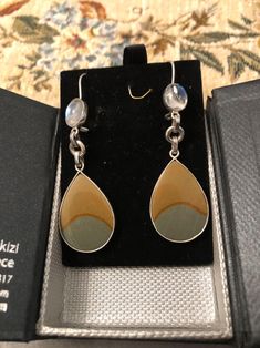 These Greek jewelry earrings are handcrafted with sterling silver and solid silver. They feature moonstone and jasper accents to give a unique, eye-catching touch. Each pair is finely crafted to ensure durability and lasting shine. Silver Drop Earrings With Natural Stones, Greek Earrings, Jasper Earrings, Greek Jewelry, Moonstone Earrings, Luxury Gift Box, Jewelry Sterling Silver, Pendant Design, Tiffany Heart