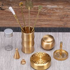 an assortment of gold colored items on a table