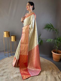 Wear this stunning off-white silk saree with peach color blouse adorned with intricate zari weaving work to make a fashionable statement at any festival, function, or wedding. The saree and unstitched blouse material come in a length of 5.50 meters, allowing you to drape it elegantly to showcase the beautiful zari work.
The off-white color adds a touch of sophistication, while the peach blouse complements the saree perfectly. This glamorous saree include the luxurious silk material that drapes e Pattu Silk Saree, Peach Blouse, Take A Screenshot, Contrast Blouse, Wear Saree, Blouse Material, Traditional Sarees, Send It, Silk Material