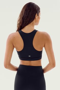 Hit the gym in our newest Rigor sports bra. A high neckline, wide racer back and longer length means support and coverage for your most vigorous workouts. BEST FOR: Running, court sports, spin class, cycling, gym workouts and other high impact workouts. Model Stats:Height: 5’10”, Bust: 32", Waist: 23.5”, Hips: 34.5”Wearing size: Small Sports Bra With Padded Back, Sports Stretch Bra With Padded Back, Stretch Activewear With Padded Back For Sports, Stretch Racerback Activewear With Padded Back, Athleisure Activewear With Padded Racerback, Fitted Sports Bra With Padded Back, Stretch Sports Bra With Padded Back For Gym, Yoga Activewear Racerback With Padded Back, Padded Back Activewear For Yoga