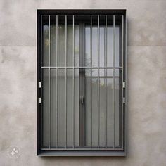 a window with bars on the side of it