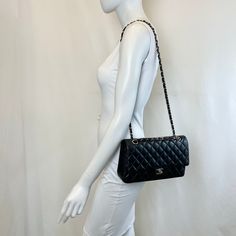 Chanel 2020 Classic Medium Double Flap Bag with Silver-tone Hardware and Turn-Lock at Front, Chain Link Shoulder Strap (Includes Authenticity Card, Seal, Dustbag) Est. Retail: $10,800, Minor Discoloration on Interior) Designer = Chanel Color = Black Material = Lamb Skin Condition = Good Height = 6 Width = 10 Depth = 2.5 Class = Premier Location: Chicago Item Number: 20559-10 Item ID: 302070 Category: Shoulder Bag Elegant Double Flap Bag For Daily Use, Black Double Flap Bag For Daily Use, Travel Bag With Chain Strap And Double Flap, Travel Bag With Double Flap And Chain Strap, Black Double Flap Shoulder Bag, Elegant Double Flap Shoulder Bag For Shopping, Chic Black Double Flap Bag, Double Flap Shoulder Bag With Dust Bag, Classic Black Flap Bag For Shopping