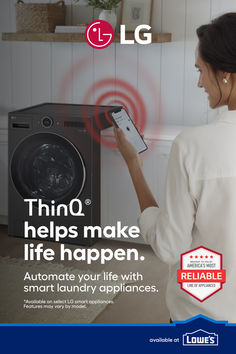 a woman is looking at her phone in front of a washing machine with the words lg help make life happen