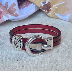 Your perfect everyday leather bracelet! Quality craftmanship with genuine leather and a cute floral slider bead. Free shipping from Red Moon Jewelry. Silver Leather Wrap Bracelet As A Gift, Silver Leather Wrap Bracelet Perfect As A Gift, Elegant Leather Wrap Bracelet As Gift, Elegant Leather Wrap Bracelet Gift, Elegant Double Band Leather Bracelet As Gift, Leather Strap Jewelry For Everyday Use, Everyday Jewelry With Leather Strap, Elegant Red Leather Bracelets, Elegant Red Leather Bracelet