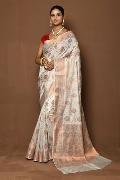 White saree woven with golden floral motifs and a floral vine border. Comes with a running blouse material.
Components: 1
Pattern: Woven
Type Of Work: Floral
Fabric: Silk
Color: White
Other Details: 
Saree length (in mtrs): 6.25
Floral vine border
Note: 
The fabric is silk blend and not pure silk
Stitched blouse worn by the model is not for sale
Occasion: Mehendi and Haldi,Sangeet - Aza Fashions Vine Border, Border Saree, Saree For Women, White Saree, Blooming Rose, Blouse Material, Floral Vine, Silk Roses, Fashion App